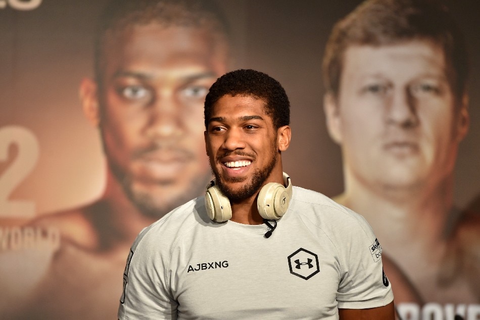 British heavyweight boxing challenger Anthony Joshua is pictured during a press conference in Ad Diriyah, a Unesco-listed heritage site, outside Riyadh, on December 4, 2019, ahead of the upcoming 'Clash on the Dunes'. File photo. Fayez Nureldine, AFP