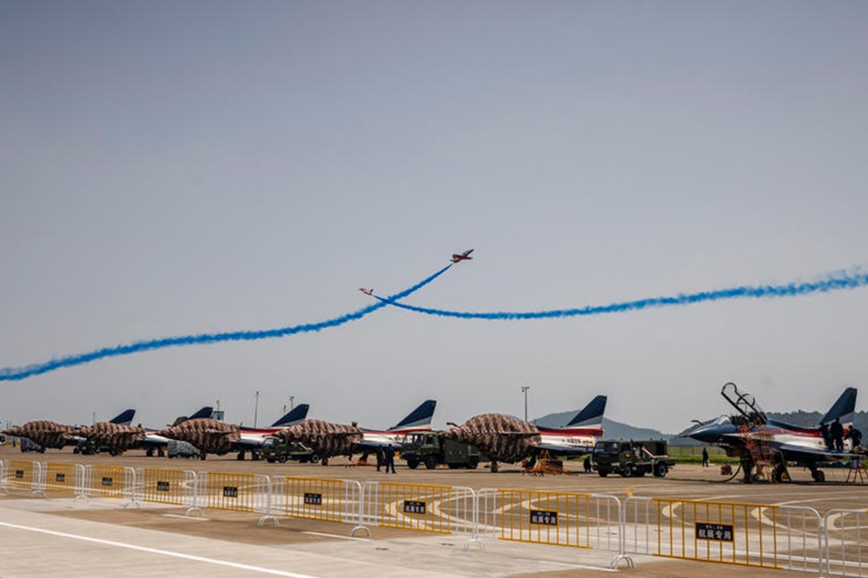 A Red Falcon Air Demonstration Team performs on Nanchang JL-8 aircraft during the 13th China International Aviation and Aerospace Exhibition in Zhuhai, Guangdong province, China, September 28, 2021. Alex Plavevski, EPA-EFE/File