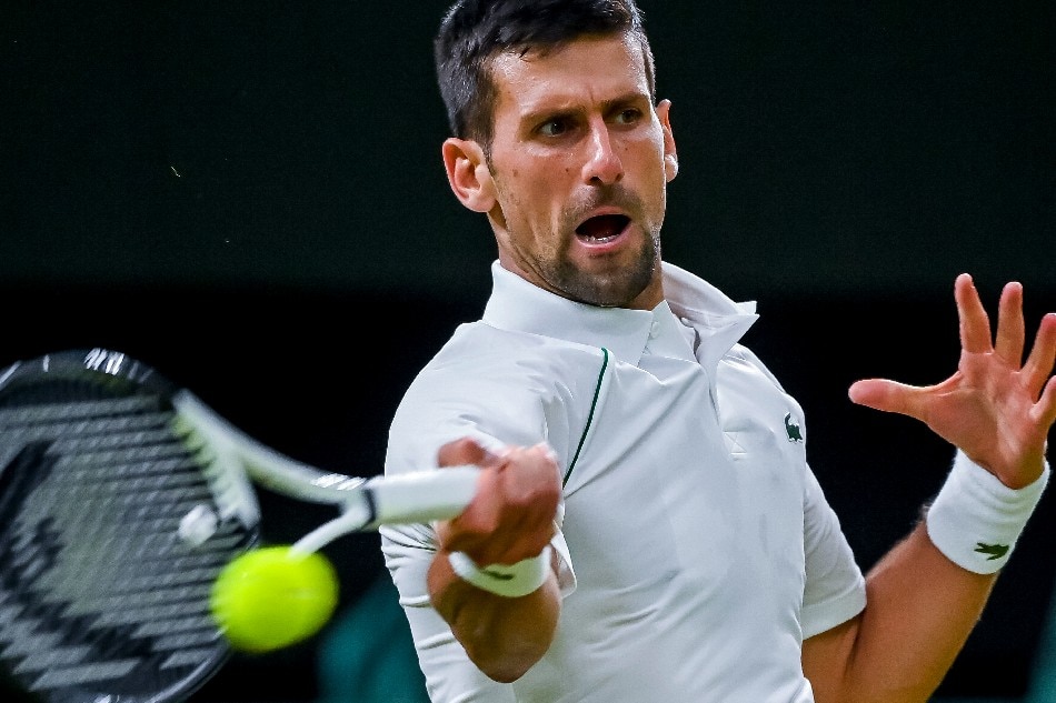 Novak Djokovic of Serbia in action against Tim van Rijthoven of the Netherlands during their Men's fourth round match at the Wimbledon Championships, in Wimbledon, Britain, 03 July 2022. Andy Rain, EPA-EFE