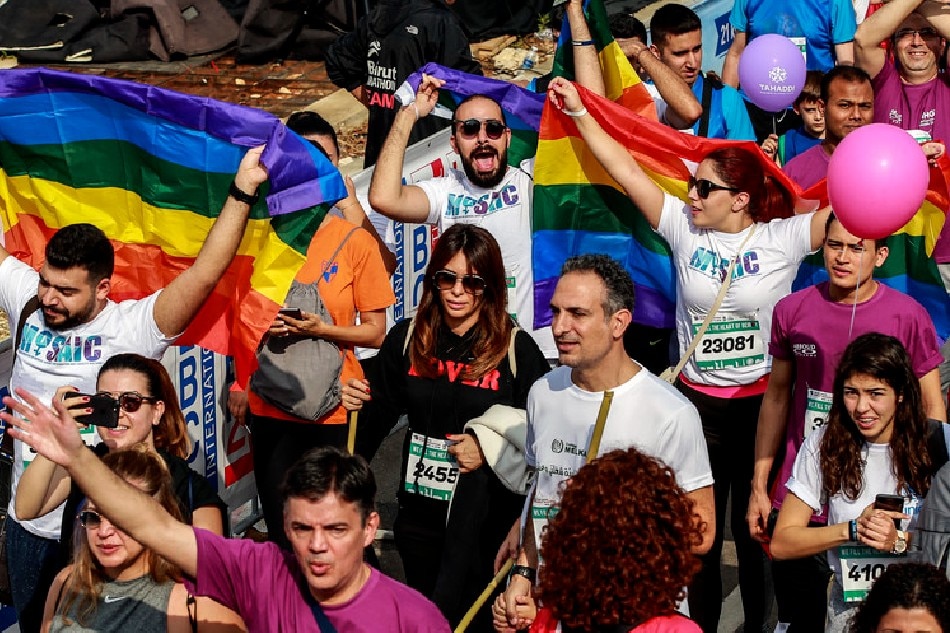 People with LGBT flags take part in the 8-kilometer fun race of the annual Beirut International Marathon in Beirut, Lebanon, November 11 2018. Nabil Mounzer, EPA-EFE/file