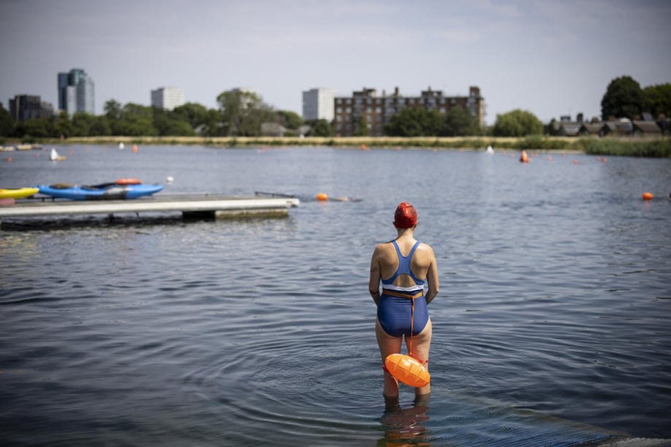 People swim at the West Reservoir in London, Britain, on July 17, 2022. Tolga Akmen, EPA-EFE