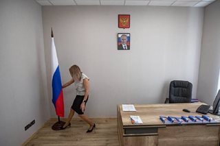 In south Ukraine, Moscow supporters snap up Russian passports