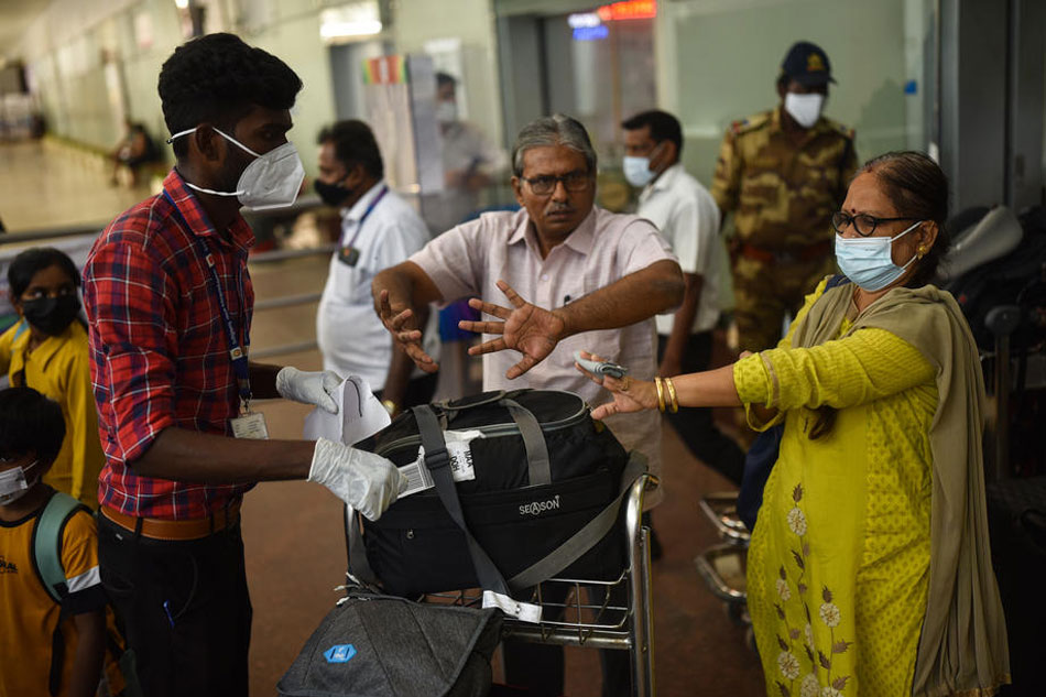 Indian health workers screen passengers arriving from high-risk countries for symptoms of the Monkeypox virus, as India reported the first case of Monkeypox in the WHO South-East Asia Region, at Chennai International Airport, in Chennai, India, July 16, 2022. Idrees Mohammed, PA-EFE 