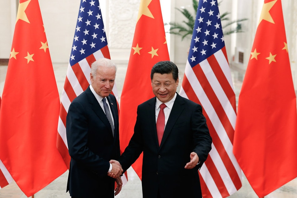 Chinese President Xi Jinping (R) shakes hands with US Vice President Joe Biden (L) inside the Great Hall of the People in Beijing, China, Dec. 4, 2013. US Vice President Joe Biden arrived for talks with Chinese leaders amid regional tension over China's newly declared air defense identification zone over the East China Sea. Lintao Zhanga, EPA/Pool/File
