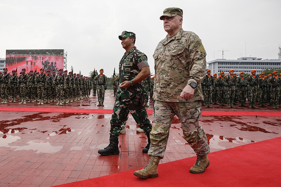 US Chairman of the Joint Chiefs of Staff General Mark Milley (R) and Indonesia's Armed Forces Chief General Andika Perkasa (L) inspect the lines of honor during their meeting at the Indonesian military headquarters in Jakarta, Indonesia, July 24, 2022. Milley is on a visit to the Southeast Asian nation to tighten military relationships between the 2 countries. Mast Irham, EPA-EFE
