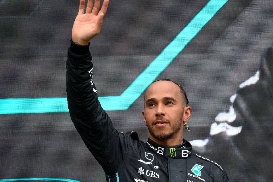 Mercedes driver Lewis Hamilton of Britain reacts on the podium after the Formula One Grand Prix of Hungary at the Hungaroring circuit in Mogyorod, near Budapest, Hungary, 31 July 2022. Zsolt Czegledi, EPA-EFE.