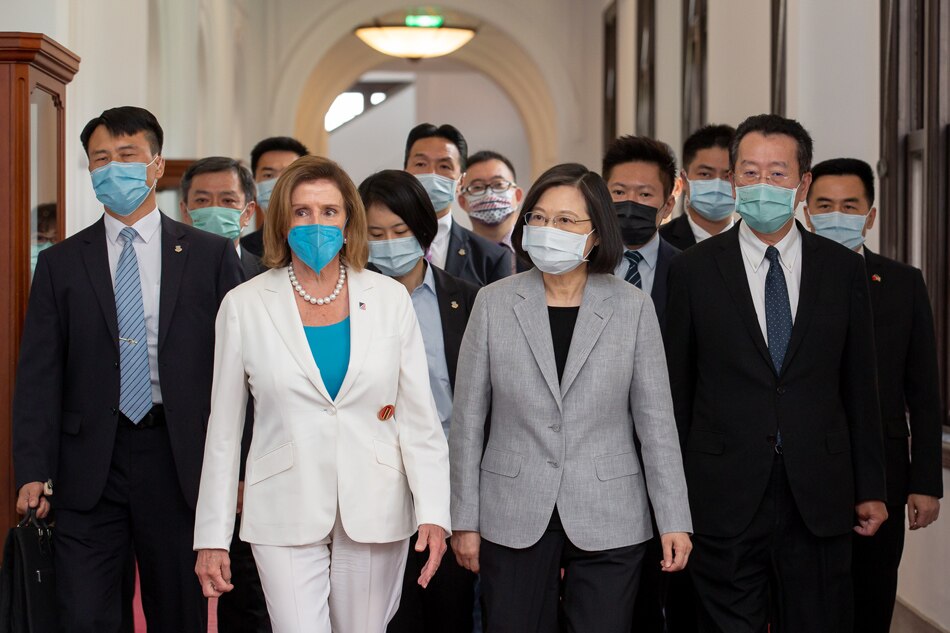 A handout photo made available by the Taiwan Presidential office shows Taiwan President Tsai Ing-wen (3-R) and US House Speaker Nancy Pelosi (2-L) walking together in a hallway at the Presidential Palace in Taipei, Taiwan, Aug. 3, 2022. Pelosi, the highest ranking US official to visit the island in 25 years, began her visit in Taiwan despite strong warnings of military action from China against the visit. Taiwan Presidential Palace, Handout/ EPA-EFE 
