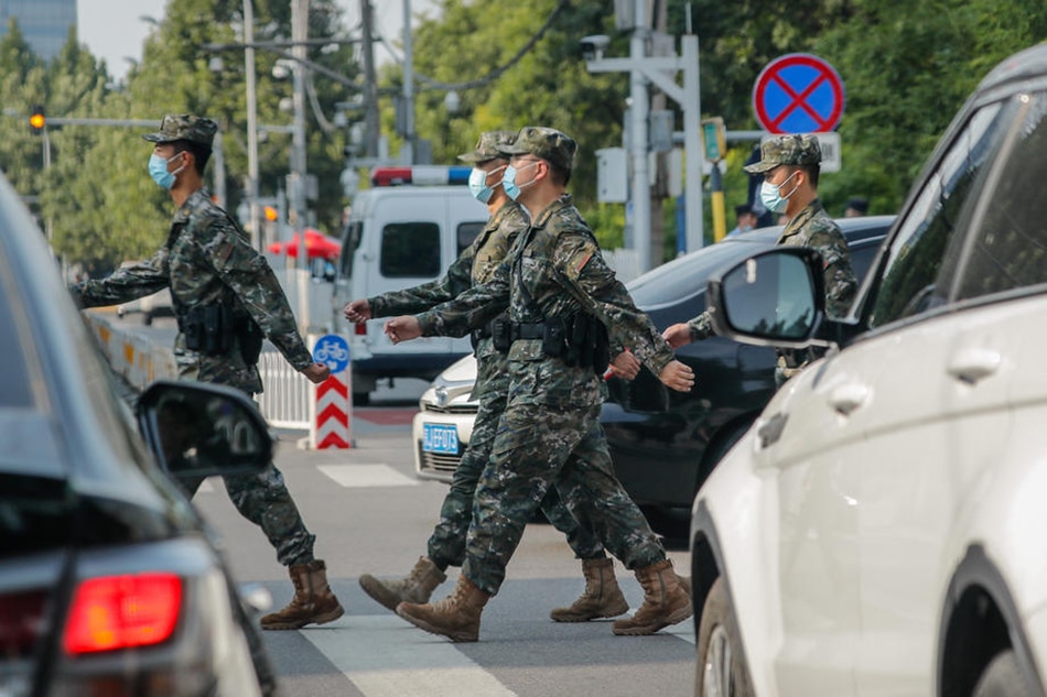 Soldiers cross a road outside the US Embassy in Beijing, August 3, 2022. Mark R. Cristino, EPA-EFE