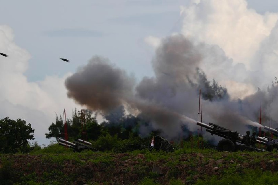 Taiwanese soldiers fire artillery during a live-fire drill in Pingtung, Taiwan, Aug. 9, 2022. Taiwan's military held a live fire drill to simulate defense of the country against a Chinese invasion, following the China's recent live fire drill in the six maritime areas around Taiwan. Ritchie B. Tongo, EPA-EFE 