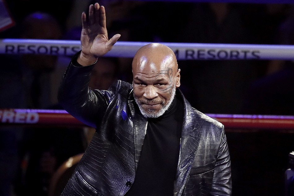 Former heavyweight champion Mike Tyson waves at the crowd before the WBC World Heavyweight Championship title fight between Deontay Wilder of the USA versus Tyson Fury of Great Britain at the Garden Arena in Las Vegas, Nevada, USA, 22 February 2020. Etienne Laurent, EPA-EFE