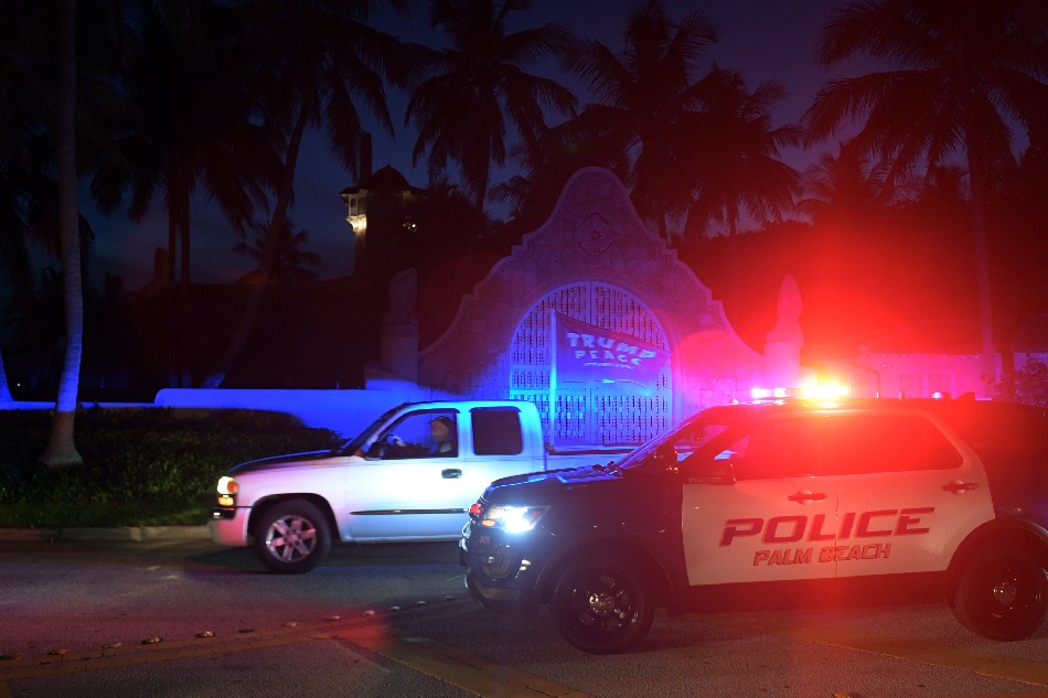 Authorities stand outside Mar-a-Lago, the residence of former president Donald Trump, amid reports of the FBI executing a search warrant as a part of a document investigation, in Palm Beach, Florida, USA, 08 August 2022. EPA-EFE/JIM RASSOL