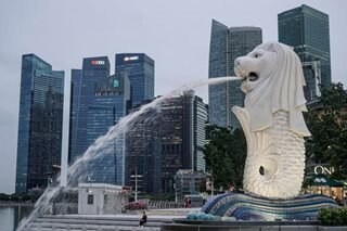 Singapore trims 2022 growth forecast on strong global headwinds