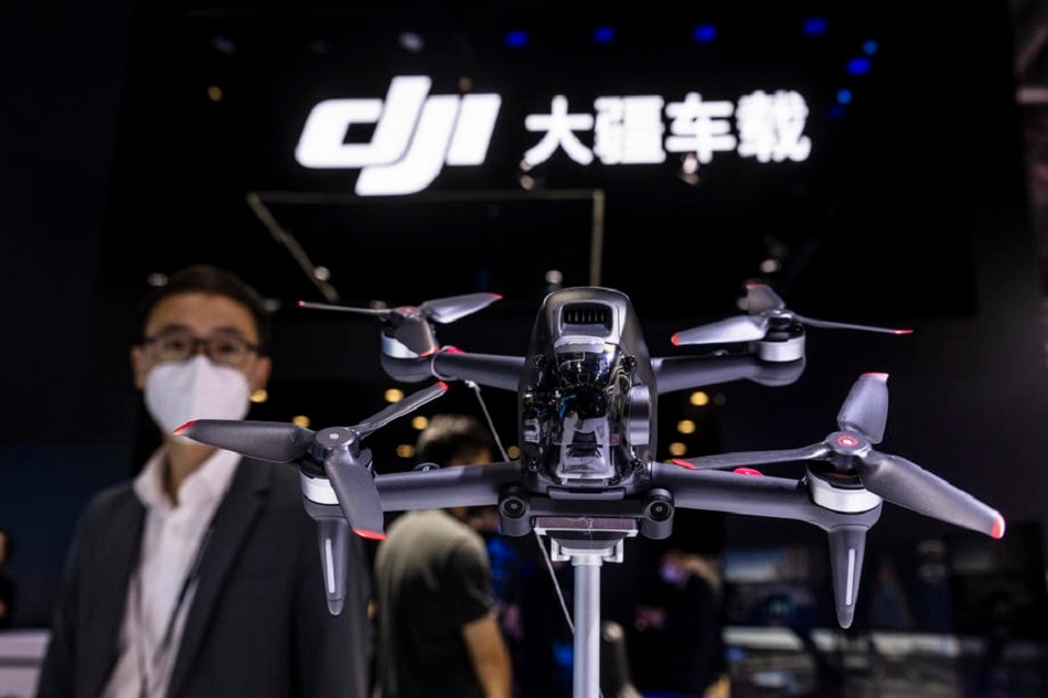 A DJI FPV drone is seen on display on the DJI trade fair stand during a media day of the Auto Shanghai 2021 motor show in Shanghai, China, on April 19, 2021. EPA-EFE/Alex Plavevski