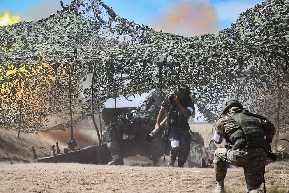 A handout photo made available by the Russian Defence Ministry press-service on 12 September 2022 shows Russian servicemen firing artillery at an undisclosed location in the Kherson region, Ukraine. On 24 February 2022 Russian troops entered the Ukrainian territory in what the Russian president declared a 