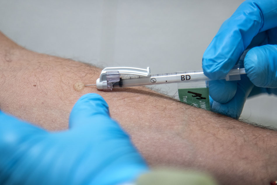 Medical staff inject a dose of the monkeypox vaccine into the arm of a person, at a vaccination clinic, in Tropical Park, Miami, Florida, USA, Aug. 12, 2022. Cristobal Herrera-Ulashkevich, EPA-EFE/file