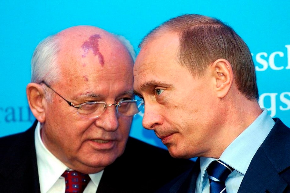Russian President Vladimir Putin and former Soviet leader Mikhail Gorbachev talk during a press conference in the northern village of Schleswig, Germany, December 21, 2004. Carsten Rehder, EPA-EFE/GERMANY OUT/file