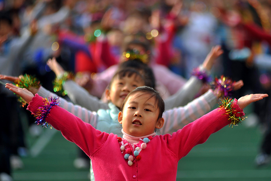  A pupil does exercise during the exercises performance event at a school in Qingdao city, eastern China