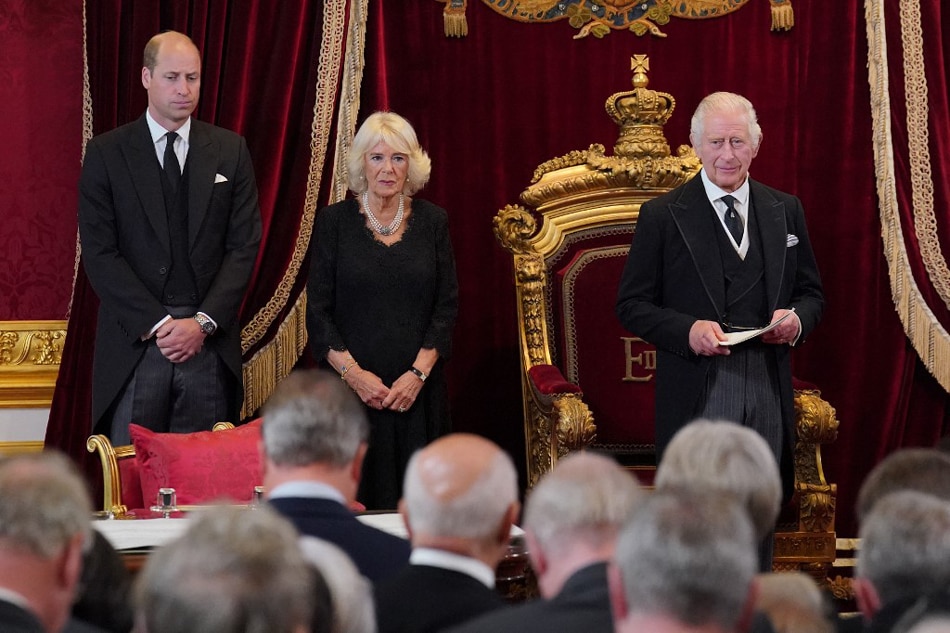 Britain's Prince William, Prince of Wales (L) and Britain's Camilla, Queen Consort listen as Britain's King Charles III (R) speaks during a meeting of the Accession Council in the Throne Room inside St James's Palace in London on September 10, 2022, to proclaim him as the new King. Jonathan Brady / POOL / AFP