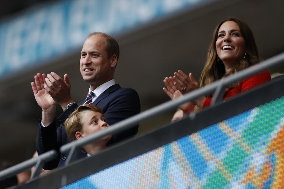 Prince William; Kate, the Duchess of Cambridge; and Prince George celebrate in the stands after a UEFA EURO 2020 match in London, June 21, 2021. Johny Sibley, pool/EPA-EFE/file