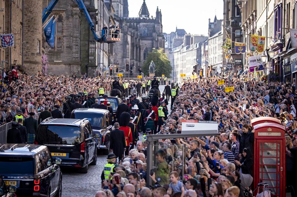 The procession of the coffin of Britain's late Queen Elizabeth II from the Palace of Holyroodhouse to St Giles' Cathedral accompanied by members of the royal family in Edinburgh, Scotland, Britain, Sept. 12, 2022. Members of the public will be able to view the coffin to pay their respects for 24 hours before it is taken to London ahead of a period of lying in state. Tolga Akmen, EPA-EFE 