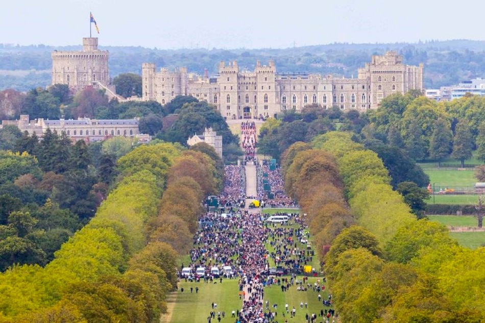 A handout picture provided by the British Ministry of Defence (MoD) showing a view of Windsor Castle as Her Majesty Queen Elizabeth II is driven along the 'long walk' in her State Hearse from London to Windsor towards her final resting place inside St George VI memorial Chapel at Windsor Castle after a State Funeral Procession of Queen Elizabeth II in London, in Windsor, September 19, 2022. Sgt. Ben Beale, RLC/British Ministry of Defense/Handout/Crown/EPA-EFE