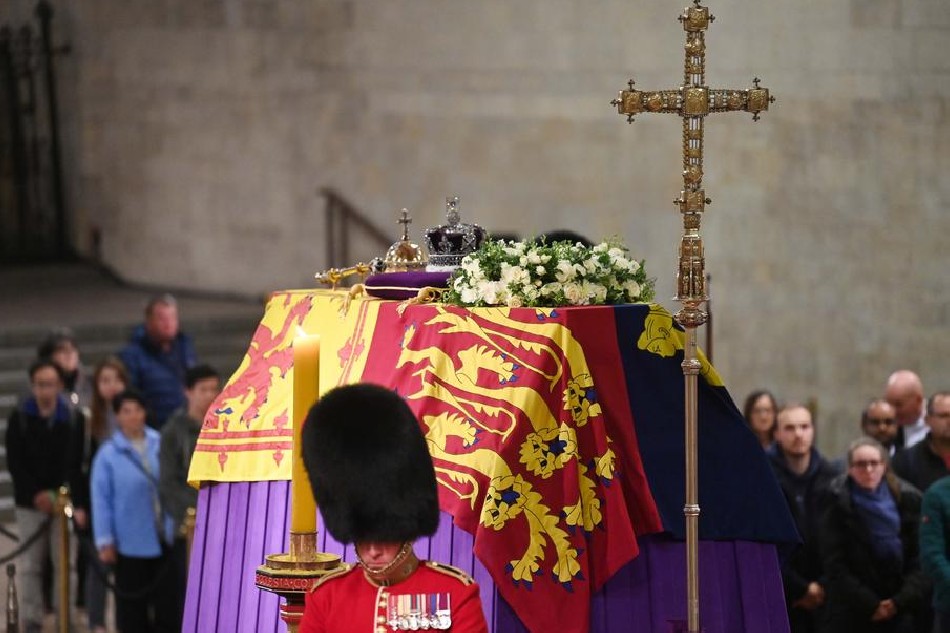 Guards attend the Lying-in-State of Britain's Queen Elizabeth II at the Palace of Westminster in London, Britain, Sept. 18, 2022. The queen's lying in state will last for 4 days, ending on the morning of the state funeral on 19 September. Neil Hall, EPA-EFE 