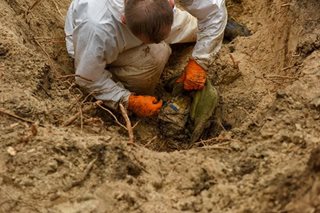 Kremlin dismisses mass grave discoveries as 'lies'