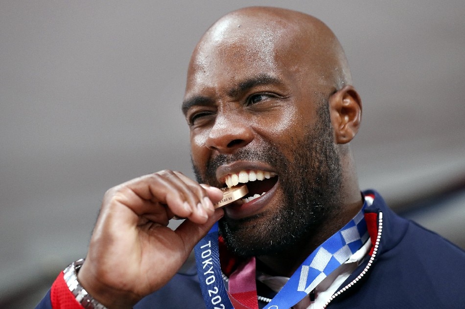 Bronze medalist Teddy Riner of France reacts on the podium during the medals ceremony for the Men +100 kg Final contest at the Judo events of the Tokyo 2020 Olympic Games at the Nippon Budokan arena in Tokyo, Japan, 30 July 2021. Ritchie B. Tongo, EPA-EFE