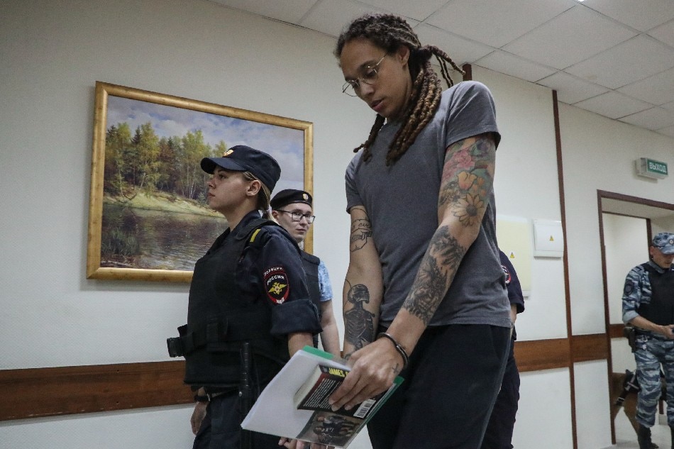 Two-time Olympic gold medalist and WNBA player Brittney Griner (C) is escorted to hear the court's verdict in Khimki City court in Khimki outside Moscow, Russia, 04 August 2022. Maxim Shipenkov, EPA-EFE