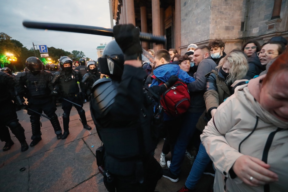 Russian policemen move in to detain participants of an unauthorized protest against the partial mobilization of hundreds of thousands of reservists due to the conflict in Ukraine, in central St. Petersburg, Russia, Wednesday. Anatoly Maltsev, EPA-EFE