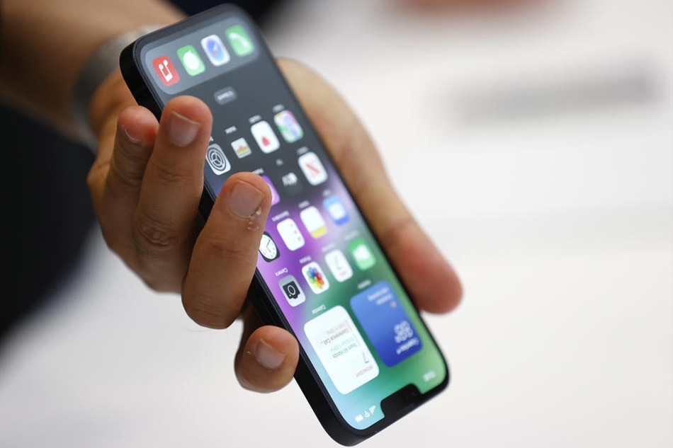 Members of the media explore the Apple iPhone 14, one of several new products introduced during an Apple Special Event on the campus of Apple Park in California, September 7, 2022. John G. Mabanglo, EPA-EFE