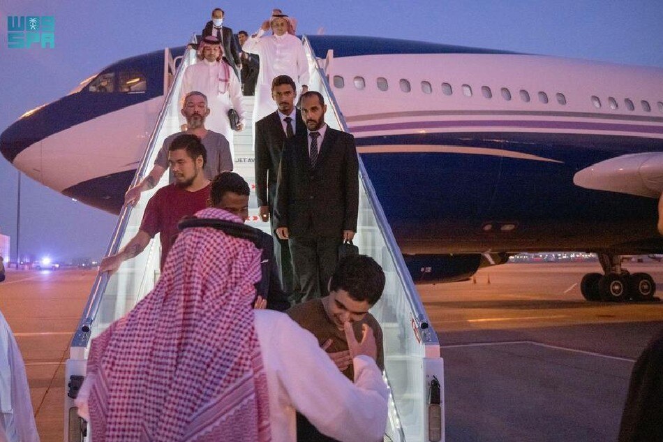 A handout photo made available by Saudi Press Agency shows prisoners released from Russia arriving at the airport in Riyadh, Saudi Arabia, on September 21, 2022 (issued September 22, 2022). EPA-EFE/Saudi Press Agency/handout