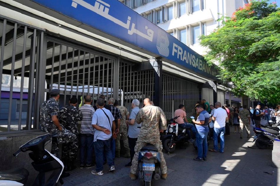 Lebanese depositors queue as they wait to withdraw money from a Fransabank branch in Beirut, Lebanon, September 26, 2022. Lebanese banks partially re-opened after a week of closure due to security concerns. Wael Hamzeh, EPA-EFE