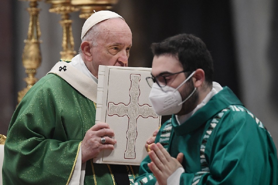 Pope Francis holds a Holy Book of Prayers during a mass on the occasion of the Sunday of the Word of God on Jan. 23, 2022 at St. Peter's basilica in The Vatican. Filippo Monteforte, AFP/File