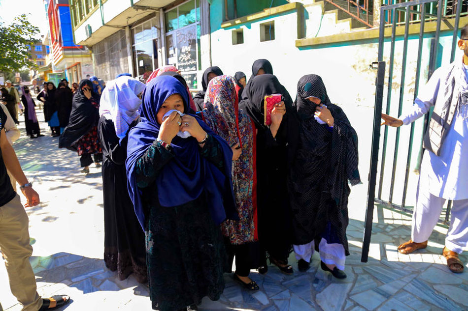 Relatives of a girl who was killed in a suicide bomb attack at a school in a Shia Hazara neighborhood, mourn during a funeral in western Kabul, Afghanistan, on September 30, 2022. EPA-EFE/STR 