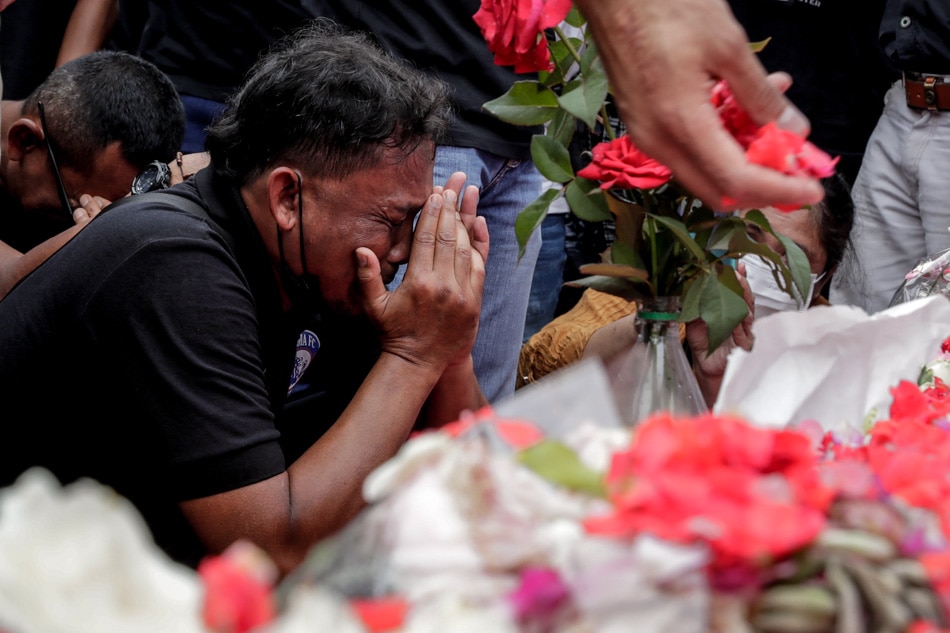 An official of Arema FC weeps as he pays condolence on Monday to the victims of the football match riot and stampede, outside Kanjuruhan Stadium in Malang, East Java, Indonesia. Mast Irham, EPA-EFE
