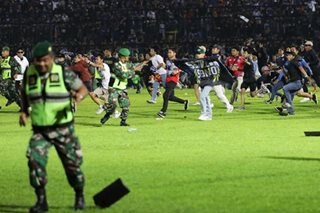 Chaos before stampede delivered disaster to Indonesia football fans