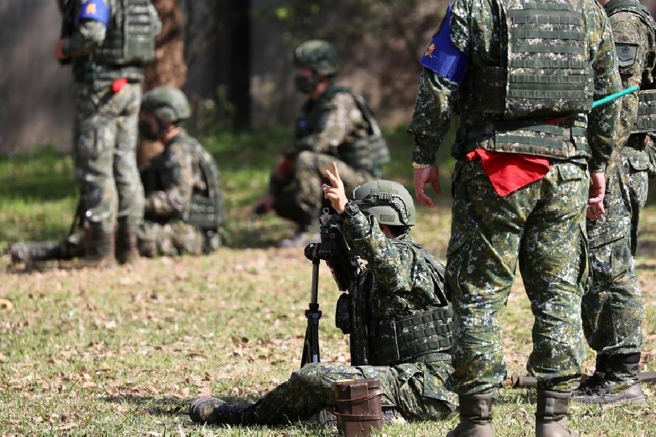 Taiwanese military personnel practice with a mortar during the visit of President Tsai Ing-wen at a military camp in New Taipei city, Taiwan, March 12, 2022. Taiwanese military and war experts are studying the current Russian invasion of Ukraine. Ritchie B. Tongo, EPA-EFE/File