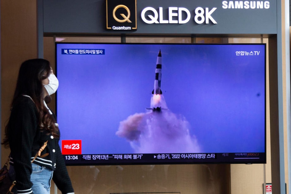 A woman watches the news about a North Korea ballistic missile launch, at a station in Seoul, September 30, 2022. Jeon Heon-kyun, EPA-EFE