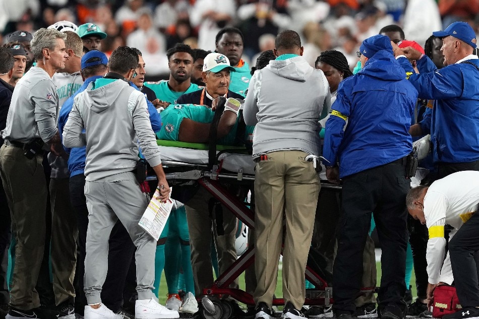 Medical staff tend to quarterback Tua Tagovailoa #1 of the Miami Dolphins as he is carted off on a stretcher after an injury during the 2nd quarter of the game against the Cincinnati Bengals at Paycor Stadium on September 29, 2022 in Cincinnati, Ohio. Dylan Buell, Getty Images/AFP.