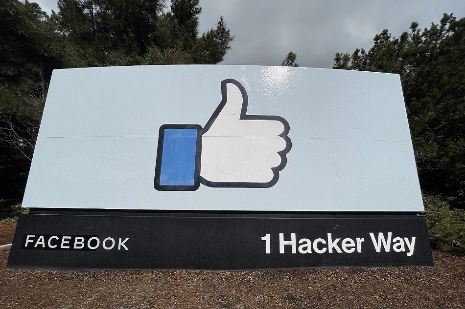A view of a sign featuring Facebook
