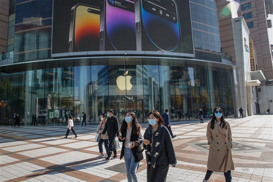 People walk past an Apple store at a mall in Beijing, China, Nov. 3, 2022. Photo by Mark Cristino, EPA/File