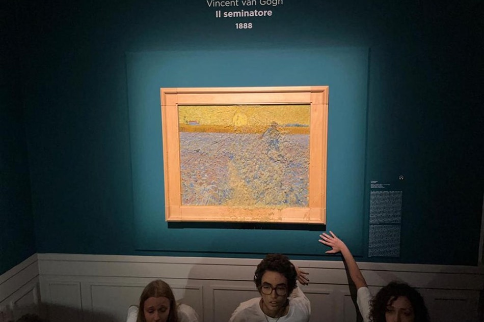 Climate activists stick their hands to the wall beneath Vincent Van Gogh's 'The Sower' at Palazzo Bonaparte, Rome, November 4, 2022. Ansa, EPA-EFE