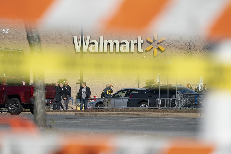 Members of law enforcement work at the scene of a mass shooting at the Walmart Supercenter in Chesapeake, Virginia, USA, 23 November 2022. The shooting at around 10:15 pm on 22 November left at least seven people including the shooter dead, police said. EPA-EFE/SHAWN THEW