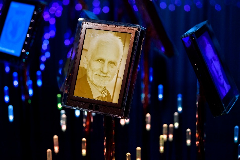 This file photo taken on October 7, 2022 shows a picture of one of the 2022 Nobel Peace Prize winners, Belarus' Human rights advocate Ales Bialiatski, on display in the Nobel's garden at the Norwegian Nobel Institute in Oslo, Norway, together with previous Peace Prize winners. Natalia Pinchuk, the wife of jailed Belarusian activist Ales Bialiatski, one of this year's Nobel Peace Prize winners, will accept the award on his behalf at the upcoming ceremony, organisers said on November 25, 2022. Bialiatski was jailed after large-scale demonstrations against the regime in 2020, when Belarus' authoritarian President Alexander Lukashenko claimed victory in elections the international community deemed fraudulent. Rodrigo FREITAS / NTB / AFP