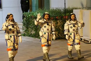 China to launch spaceship with astronauts to complete space station
