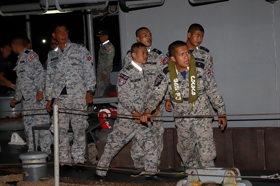 A handout photo made available by the Royal Thai Navy shows Thai navy personnel on duty during the rescue of the Royal Thai Navy Sukhothai crew after the ship capsized and sank in rough seas in the Gulf of Thailand, at a pier in Bang Saphan District, Prachuap Khiri Khan Province, Thailand, December 19, 2022. The Royal Thai Navy ship HTMS Sukhothai, carrying over 100 crew, capsized and sank in rough seas in the Gulf of Thailand on late 18 December night. Authorities rescued most of the crew and a search for 30 missing sailors continued on 19 December, Thai Navy spokesman Pogkrong Monthardpalin said. EPA-EFE/THE ROYAL THAI NAVY/HANDOUT