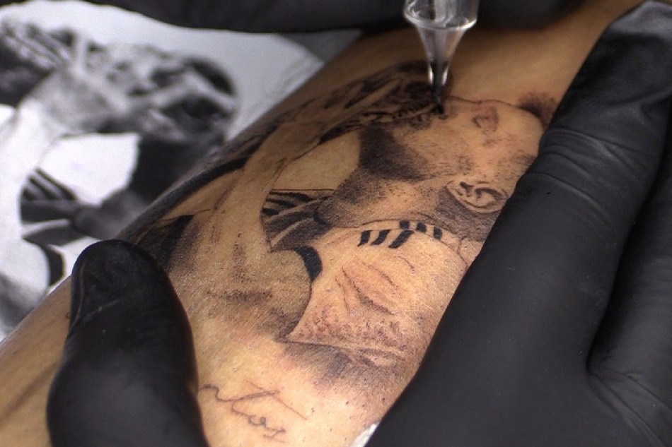 More than skin deep: Fans line up for Messi tattoos | ABS-CBN News