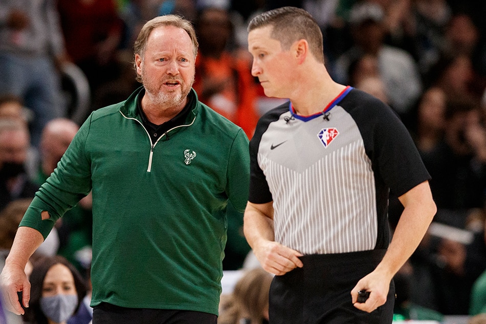 Bucks head coach Mike Budenholzer talks with an official during a game against the Celtics on December 25, 2021. Jeff Hanisch, USA Today Sports/Reuters