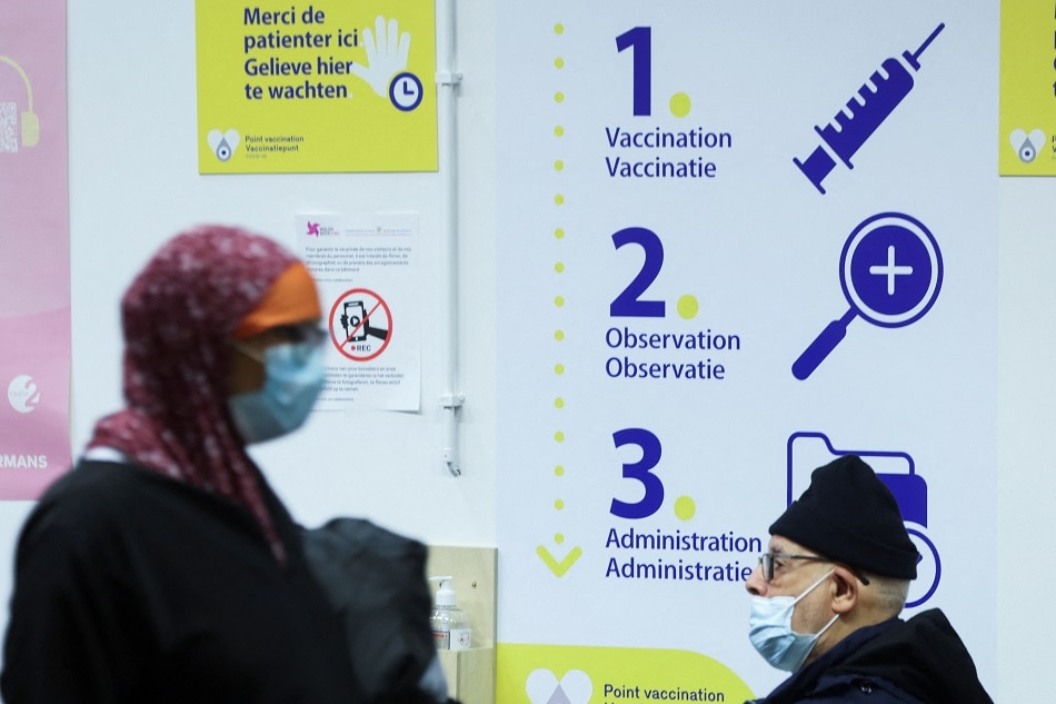 People wait after receiving a booster dose of Pfizer's COVID-19 vaccine at a vaccination centre in Brussels, Belgium, January 5, 2022. Reuters, Yves Herman